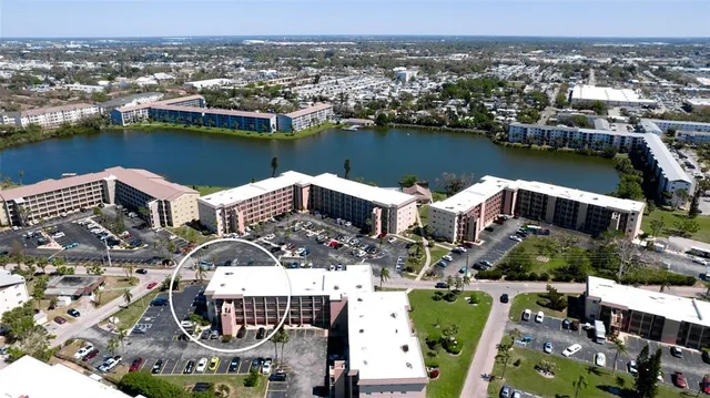 a view of balcony with wooden floor and lake view