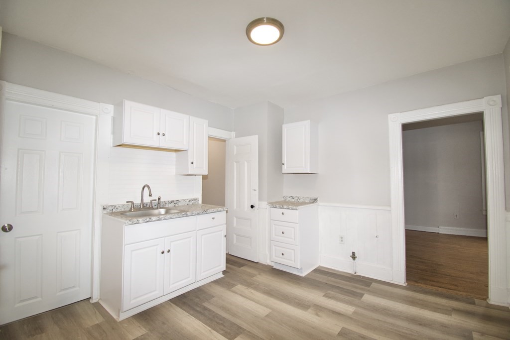 72 Malden Street Springfield, MA 01108 - Photo 14 of 25 a spacious bathroom with a double vanity sink a mirror and a bathtub