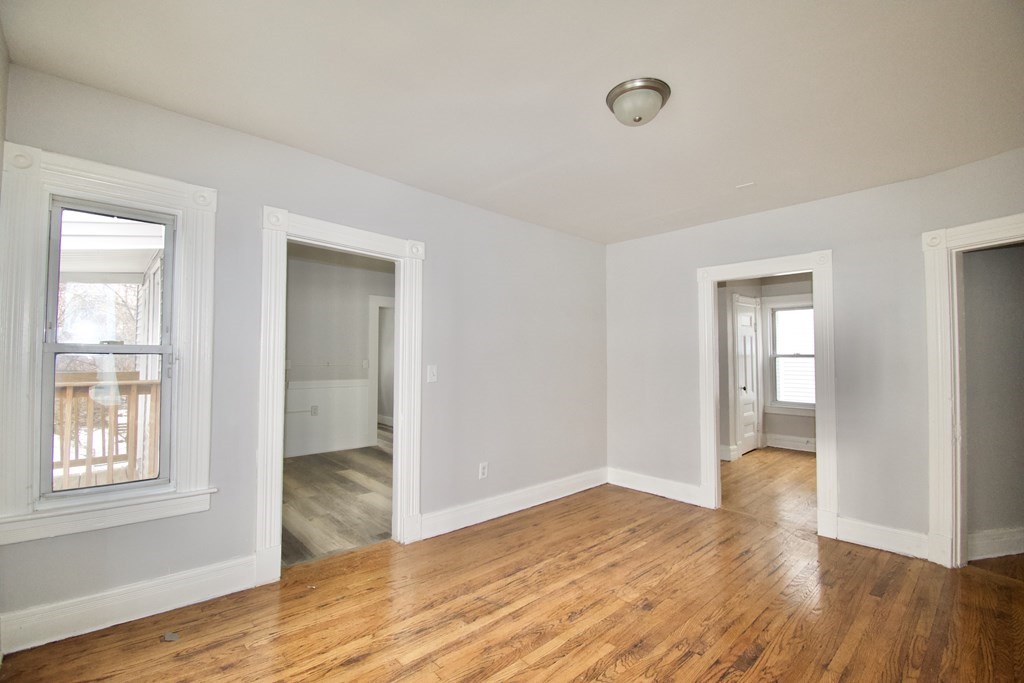 72 Malden Street Springfield, MA 01108 - Photo 19 of 25 a view of empty room with wooden floor and fan