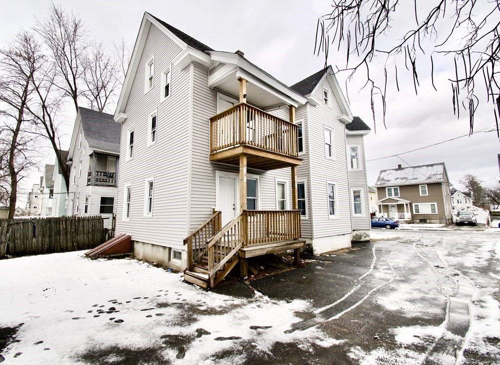 72 Malden Street Springfield, MA 01108 - Photo 5 of 25 a view of a street with snow on the road