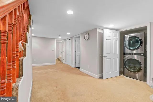 a view of a hallway with washer and dryer
