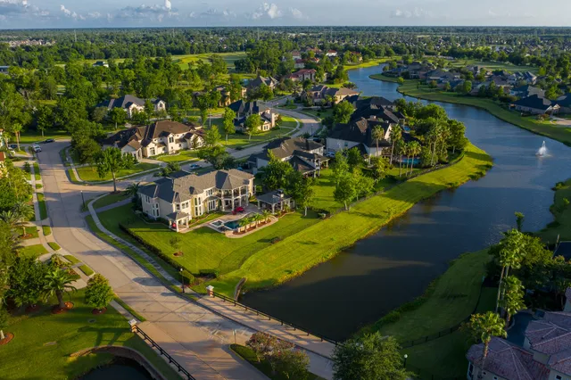 an aerial view of a house with a lake view