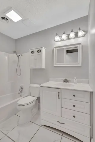a bathroom with a sink double vanity and a mirror