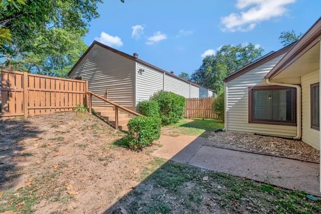 a view of backyard and small cabin