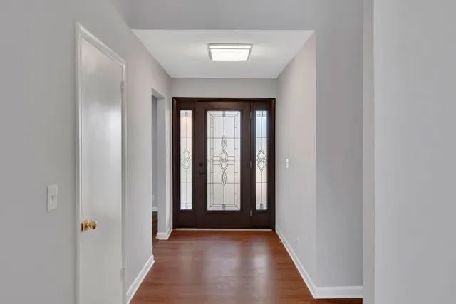 a view of entryway with wooden floor
