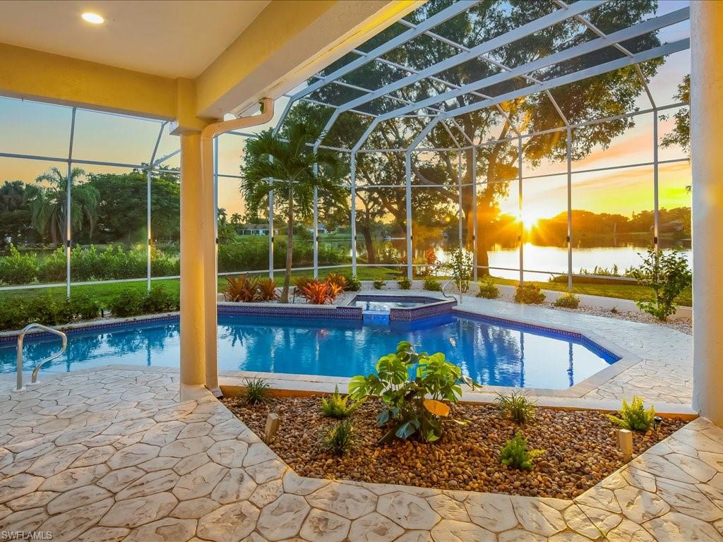 2115 Imperial Golf Course Boulevard Naples, FL 34110 - Photo 1 of 50 a view of a porch with a table and chairs