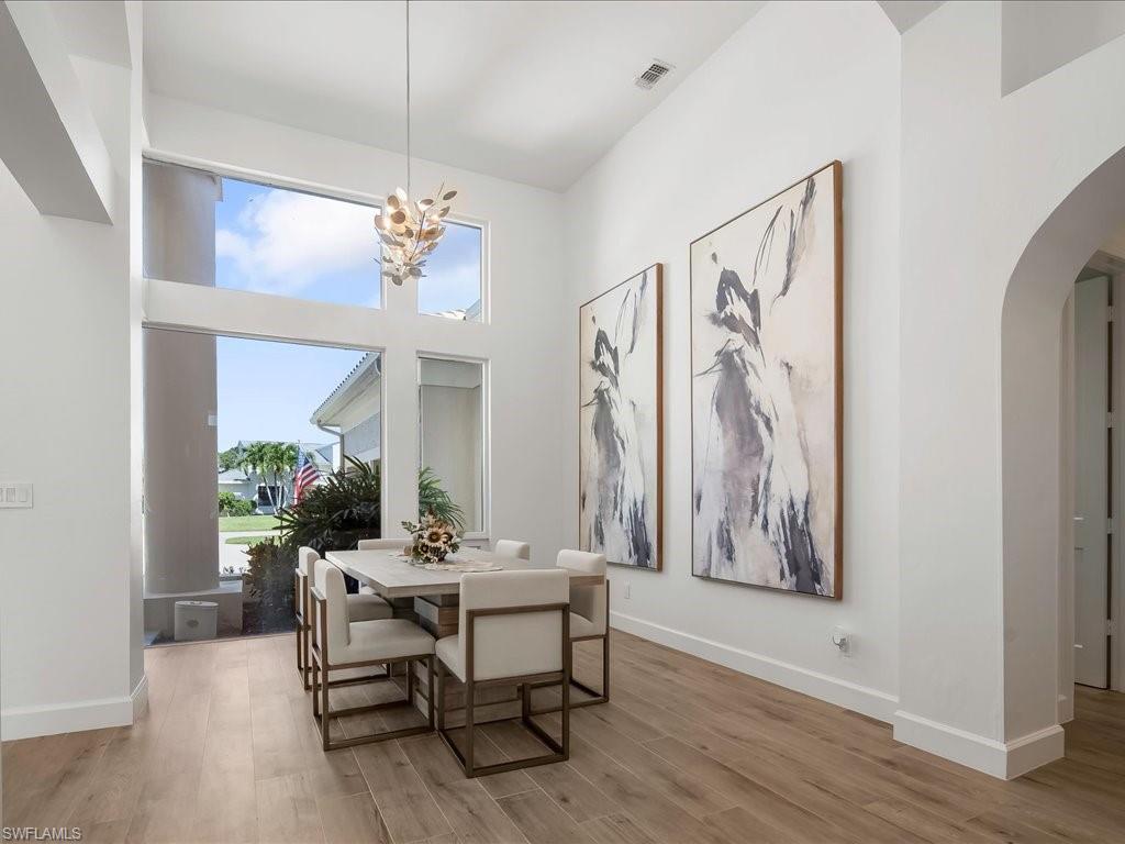 2115 Imperial Golf Course Boulevard Naples, FL 34110 - Photo 17 of 50 a dining room with furniture and window