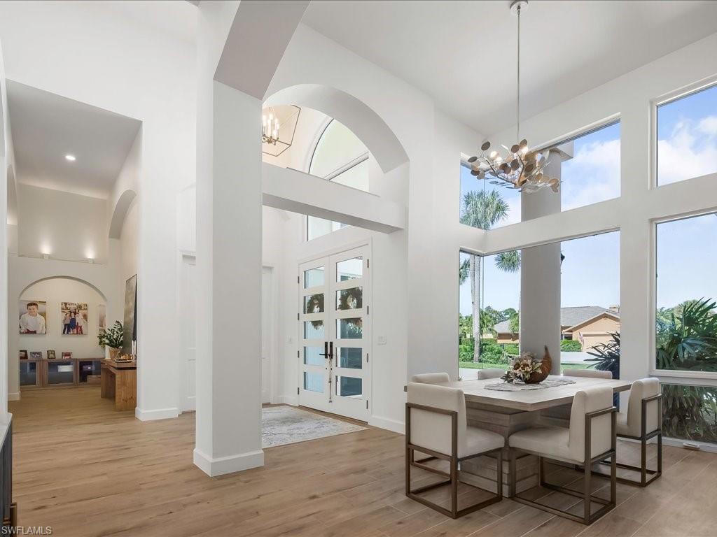 2115 Imperial Golf Course Boulevard Naples, FL 34110 - Photo 18 of 50 a view of a livingroom with furniture and a table