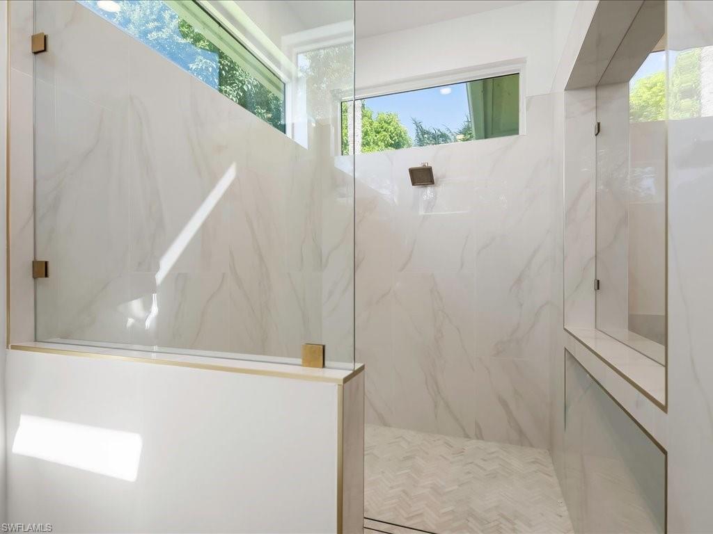 2115 Imperial Golf Course Boulevard Naples, FL 34110 - Photo 23 of 50 a bathroom with a shower