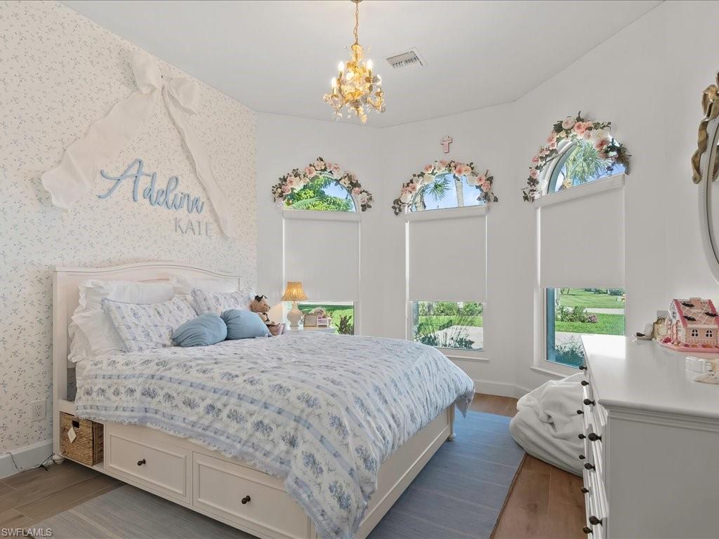 2115 Imperial Golf Course Boulevard Naples, FL 34110 - Photo 24 of 50 a bedroom with bed and window