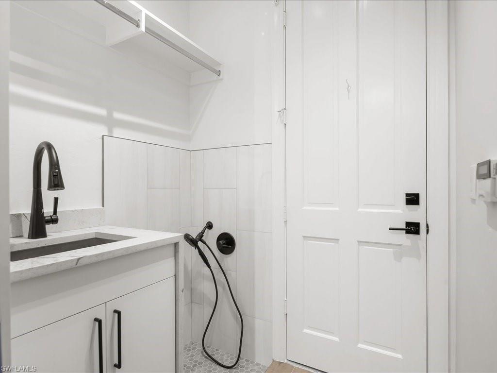 2115 Imperial Golf Course Boulevard Naples, FL 34110 - Photo 33 of 50 a bathroom with a shower