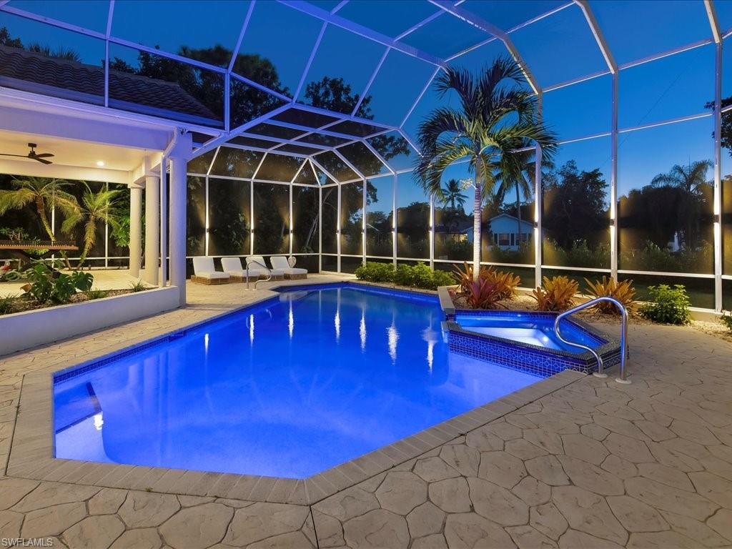2115 Imperial Golf Course Boulevard Naples, FL 34110 - Photo 48 of 50 a swimming pool with outdoor seating