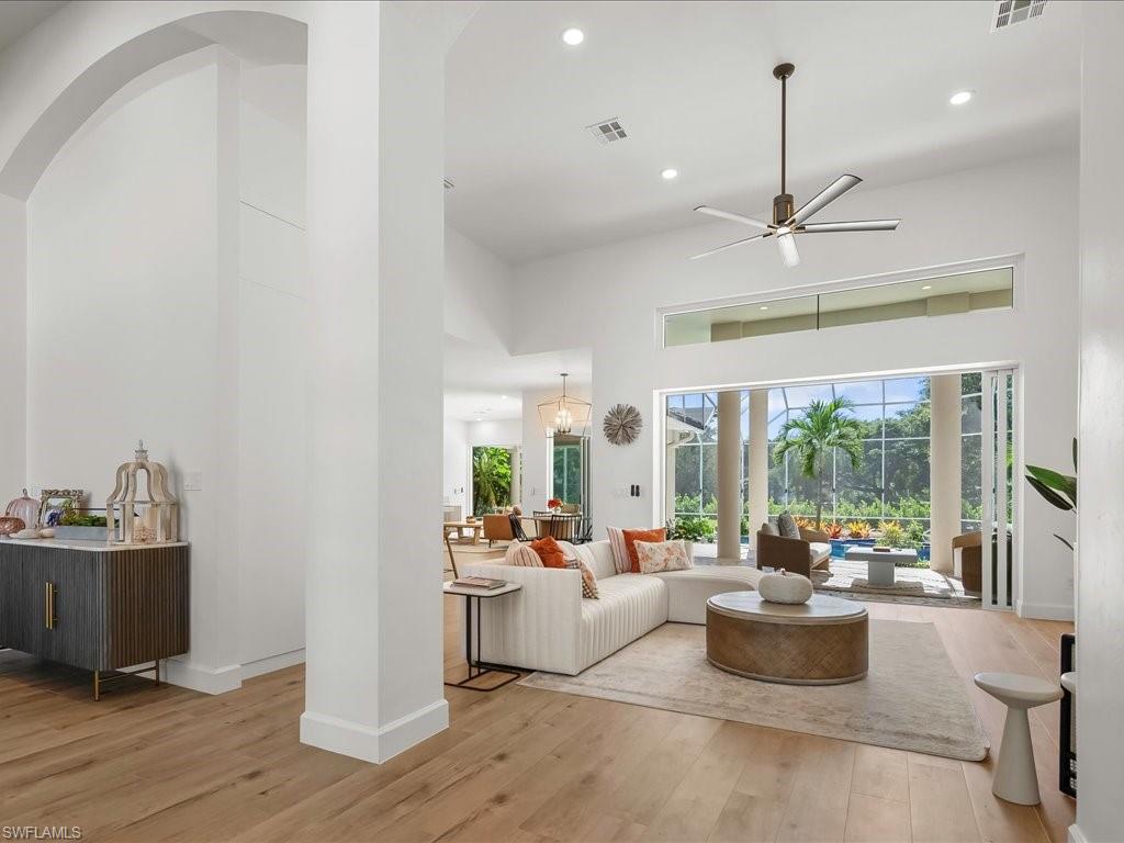 2115 Imperial Golf Course Boulevard Naples, FL 34110 - Photo 8 of 50 a living room with furniture and a large window