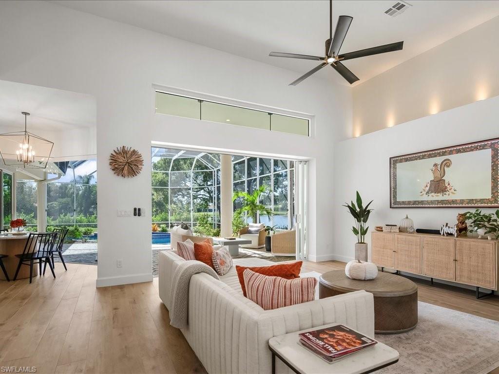 2115 Imperial Golf Course Boulevard Naples, FL 34110 - Photo 10 of 50 a living room with furniture and a large window