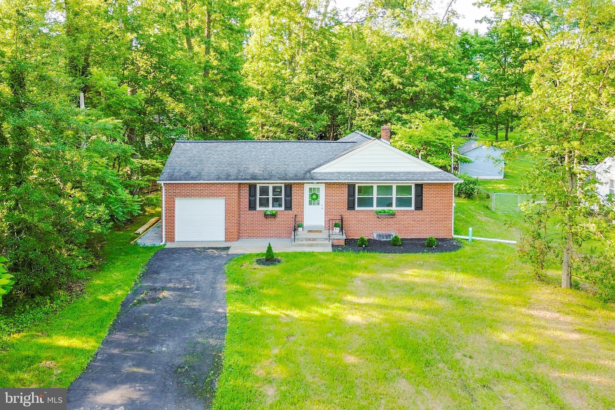 515 Park Road Spring City, PA 19475 - Photo 1 of 38 a front view of a house with yard and green space