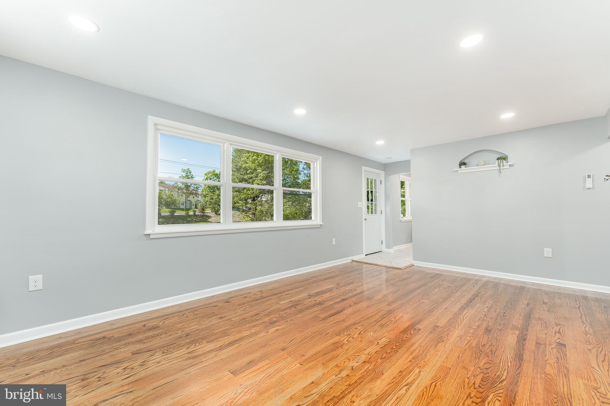 515 Park Road Spring City, PA 19475 - Photo 11 of 38 a view of an empty room with wooden floor and a window