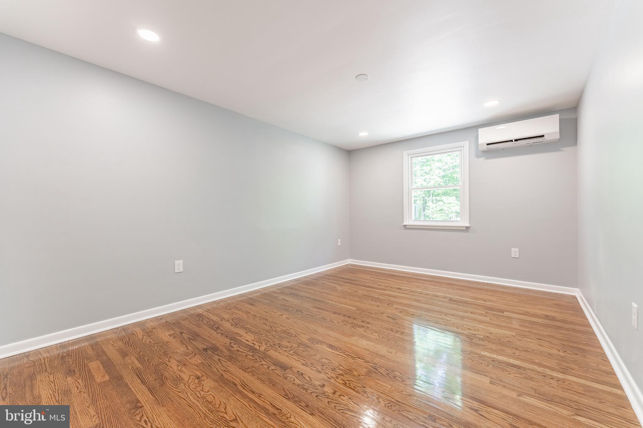 515 Park Road Spring City, PA 19475 - Photo 30 of 38 an empty room with wooden floor and windows