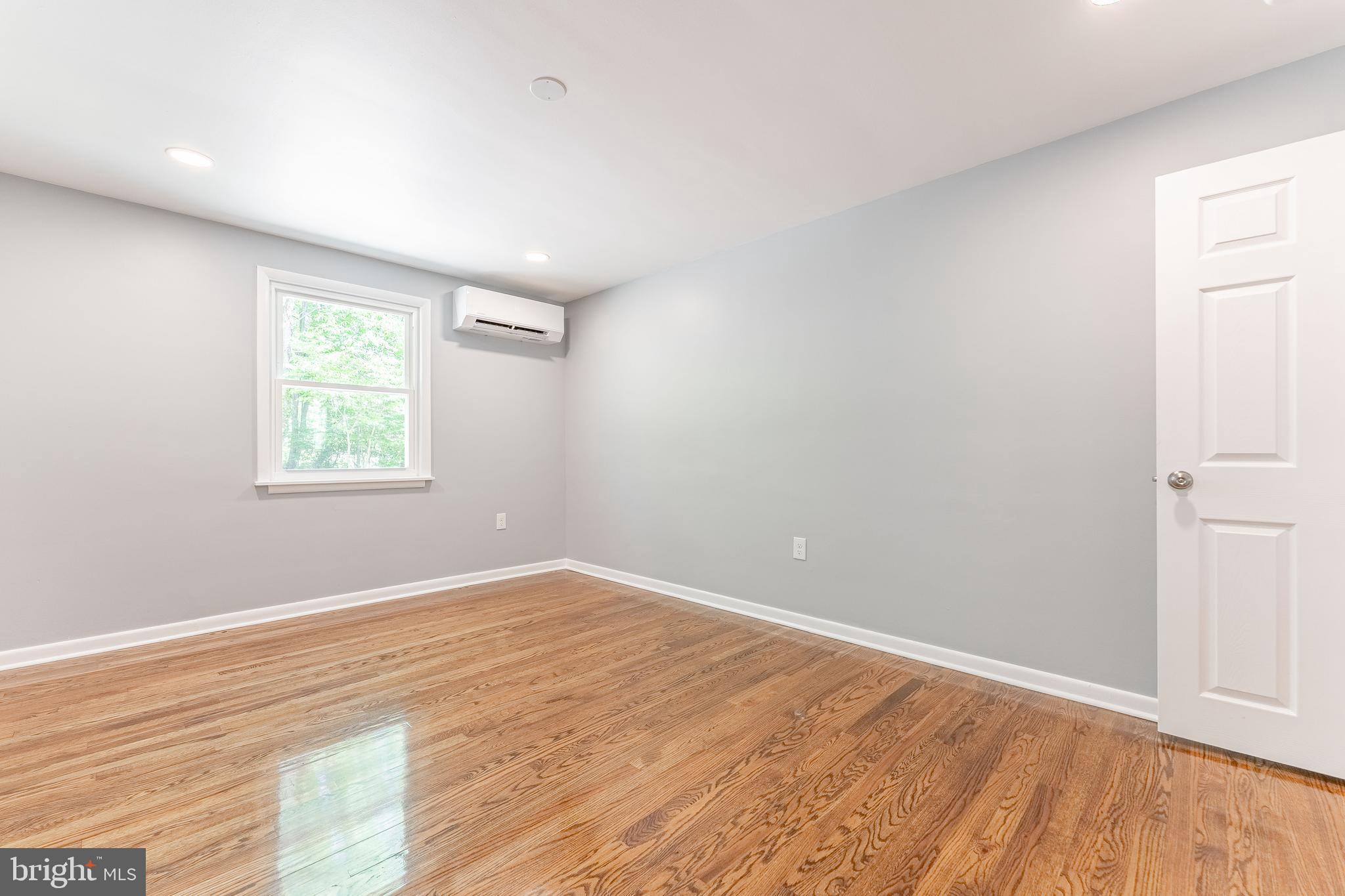 515 Park Road Spring City, PA 19475 - Photo 31 of 38 an empty room with wooden floor and windows