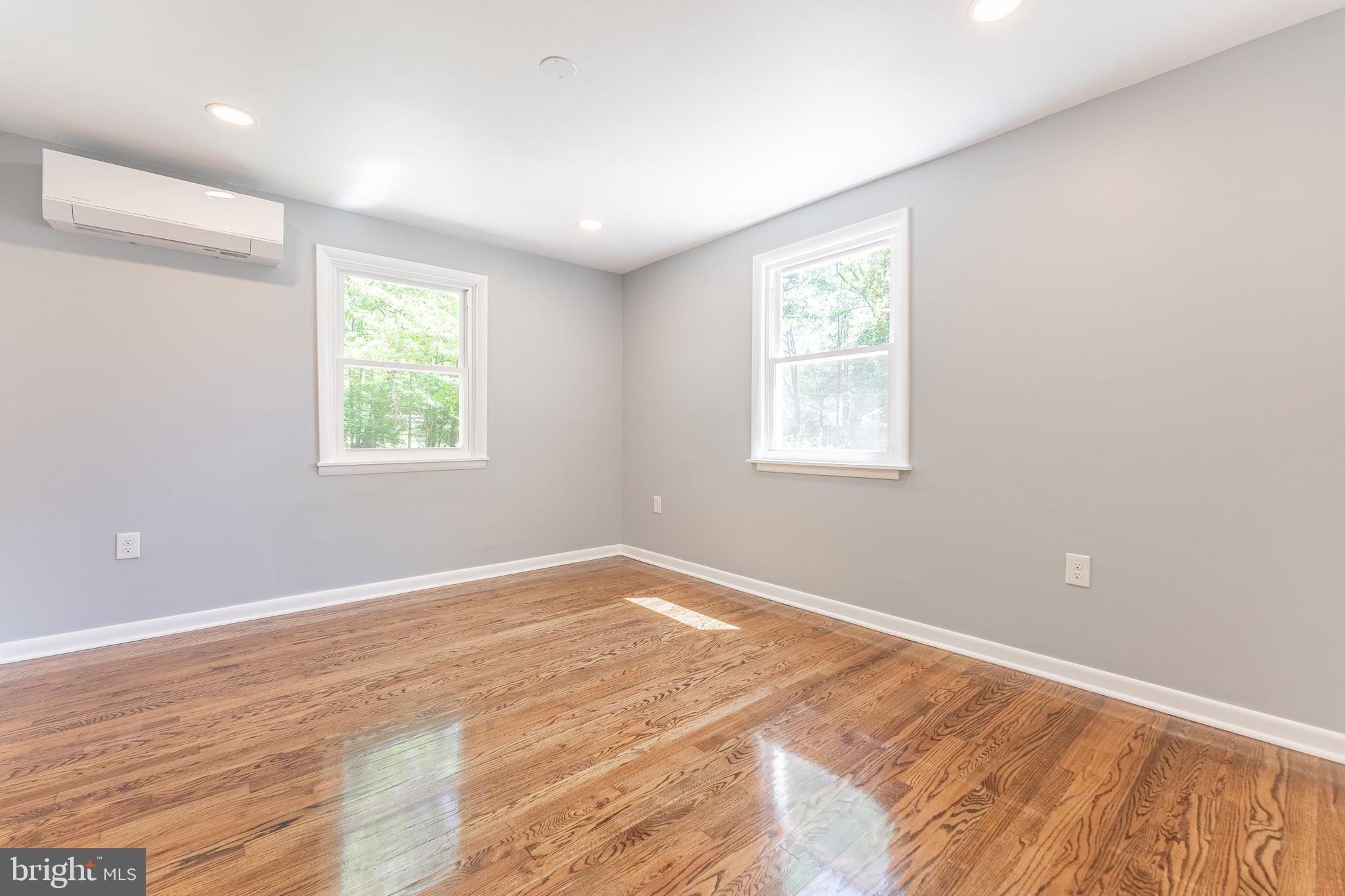 515 Park Road Spring City, PA 19475 - Photo 34 of 38 an empty room with wooden floor and windows