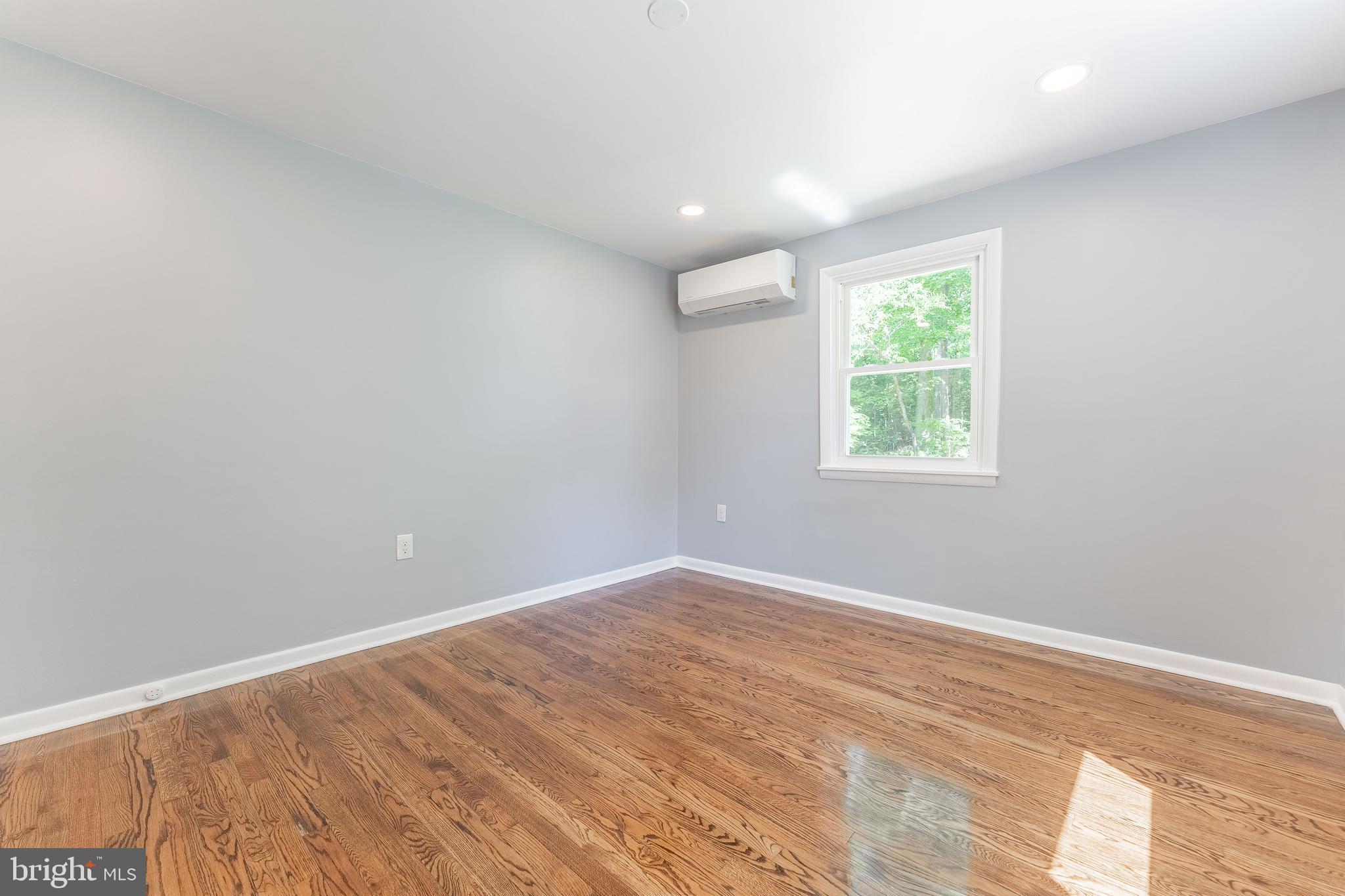 515 Park Road Spring City, PA 19475 - Photo 35 of 38 an empty room with wooden floor and windows