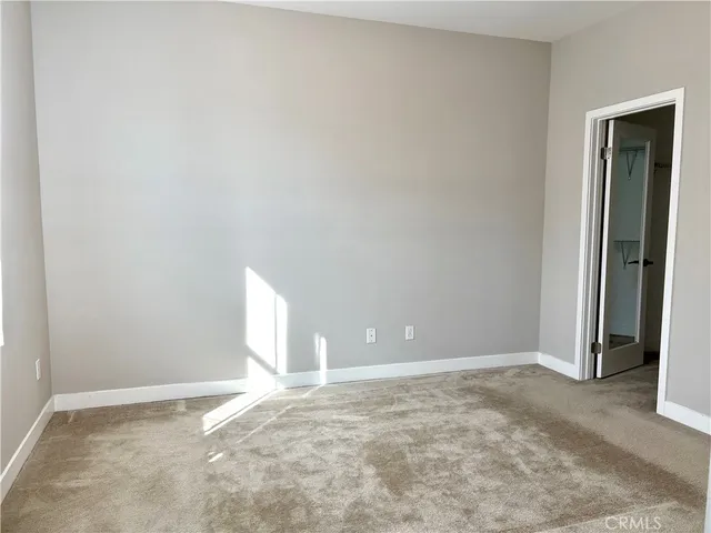 an empty room with a empty space and window