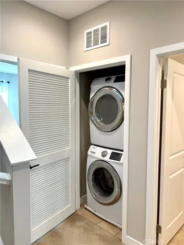 a view of a hallway with washer and dryer