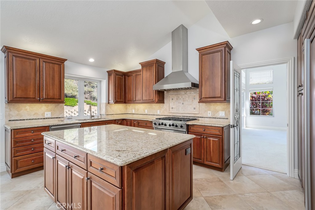 19 Springbrook Road Laguna Niguel, CA 92677 - Photo 17 of 50 a kitchen with stainless steel appliances granite countertop a sink stove and refrigerator