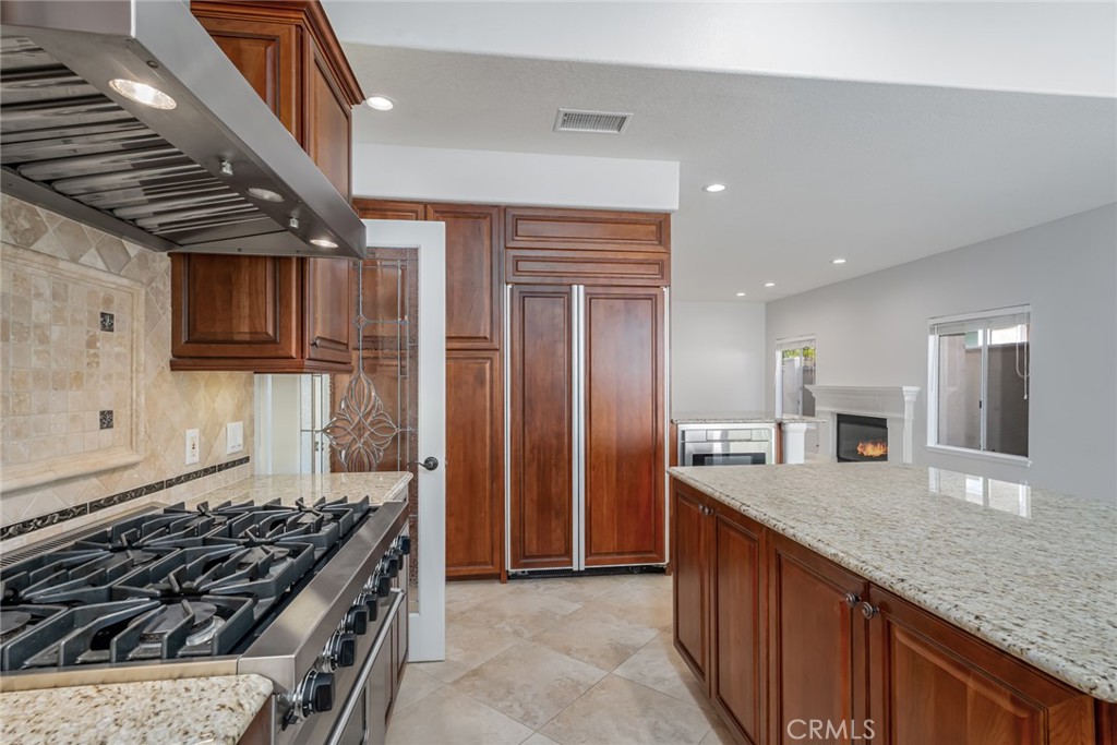 19 Springbrook Road Laguna Niguel, CA 92677 - Photo 19 of 50 a kitchen with stainless steel appliances granite countertop a stove and a sink