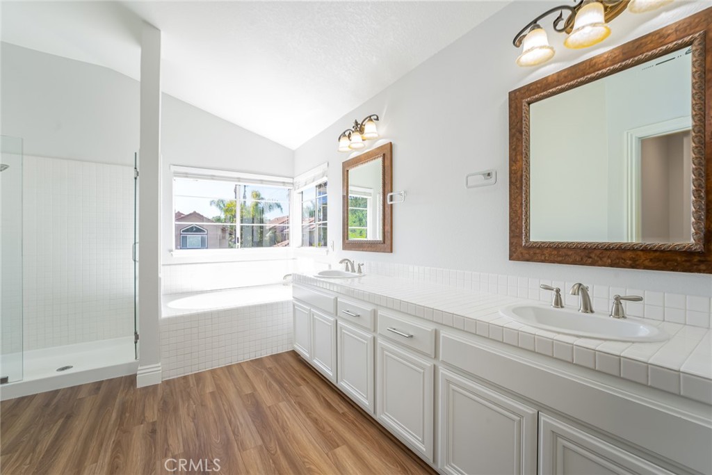 19 Springbrook Road Laguna Niguel, CA 92677 - Photo 26 of 50 a bathroom with a double vanity sink and a mirror