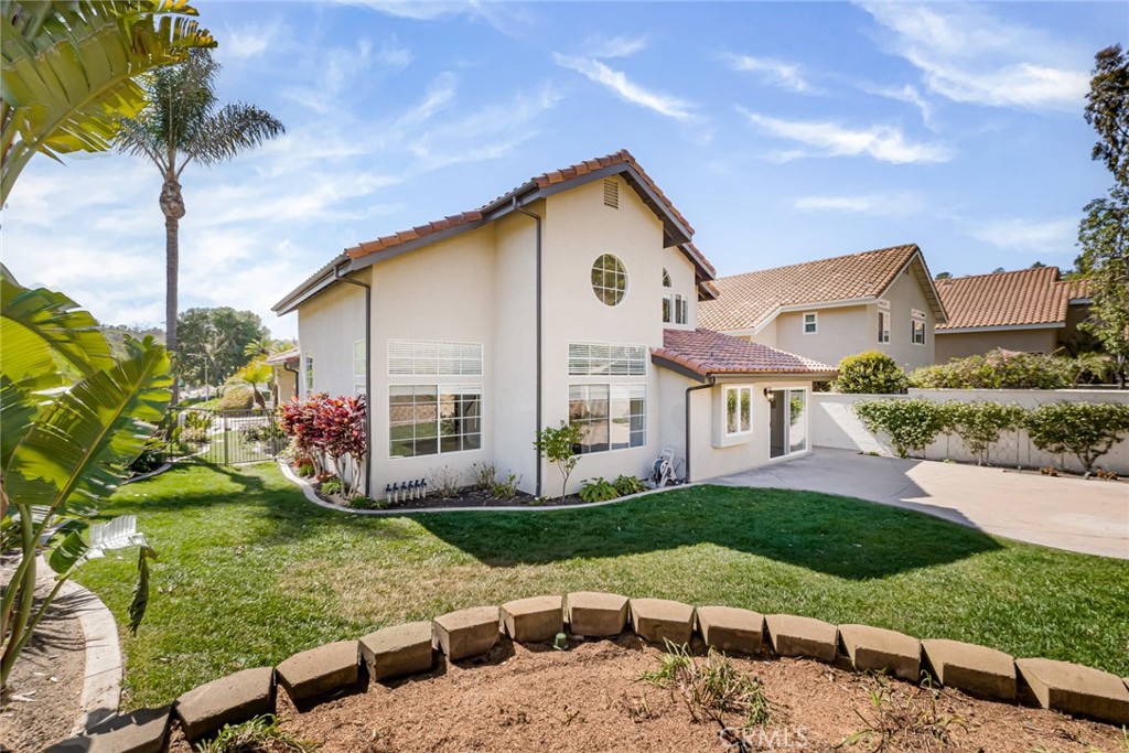 19 Springbrook Road Laguna Niguel, CA 92677 - Photo 35 of 50 a front view of a house with garden