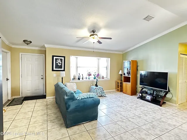 a spacious bedroom with a bed and window