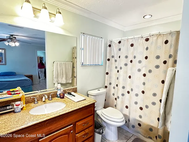 a bedroom with bed and window