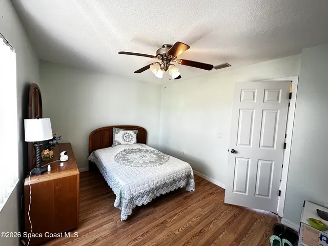 a view of a livingroom with furniture and wooden floor