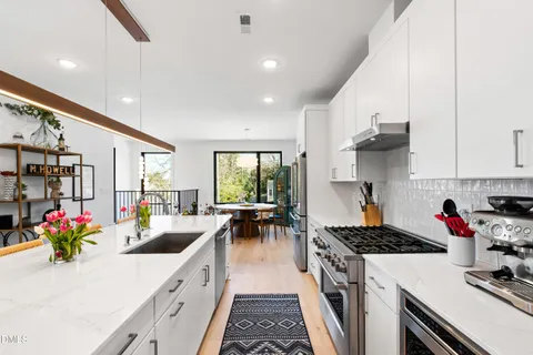 a kitchen with a sink and a refrigerator