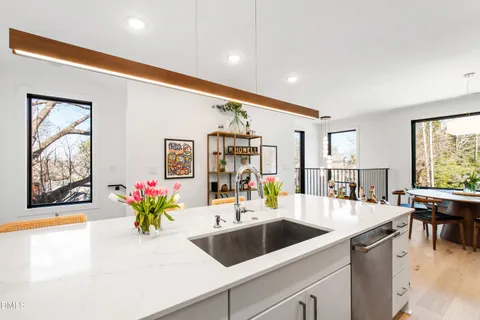 a bedroom with a bed and a refrigerator