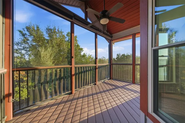 a view of a balcony with wooden floor
