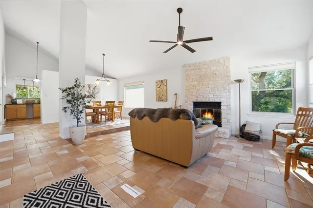 a living room with furniture and a fireplace