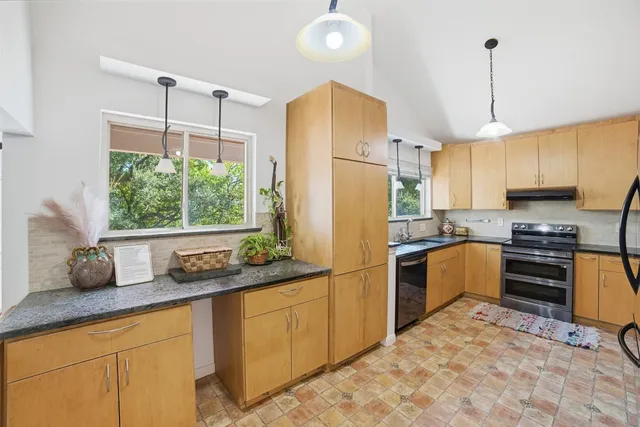 a kitchen with refrigerator cabinets and furniture