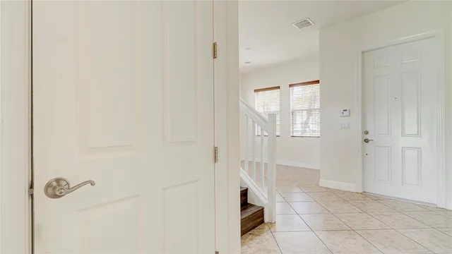 a bathroom with a granite countertop sink a mirror and a bathtub