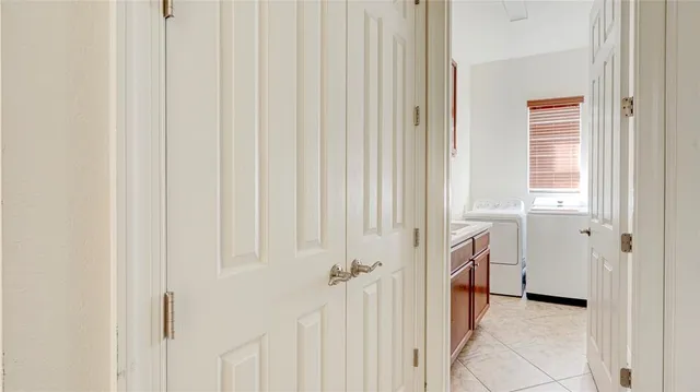 an empty room with a hardwood and ceiling fan