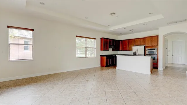 a kitchen with granite countertop a sink and a stove