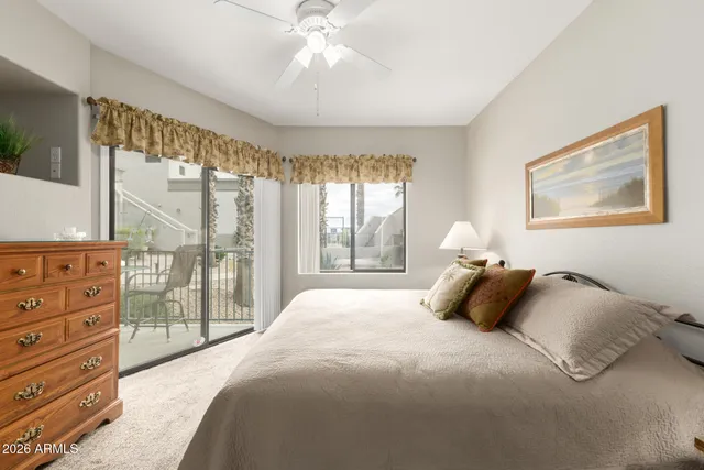 a bedroom with a large bed and a window