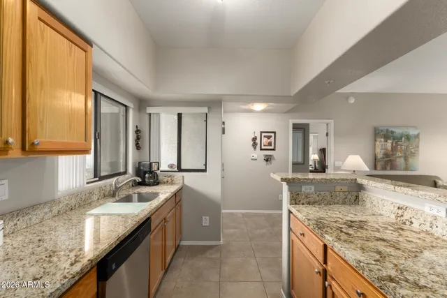a kitchen with granite countertop sink and granite top