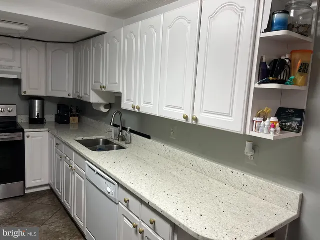 a kitchen with a sink and cabinets