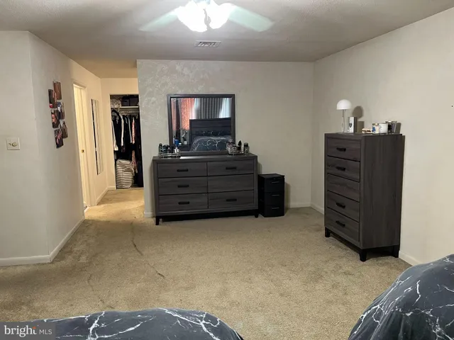 a room with a bed and furniture