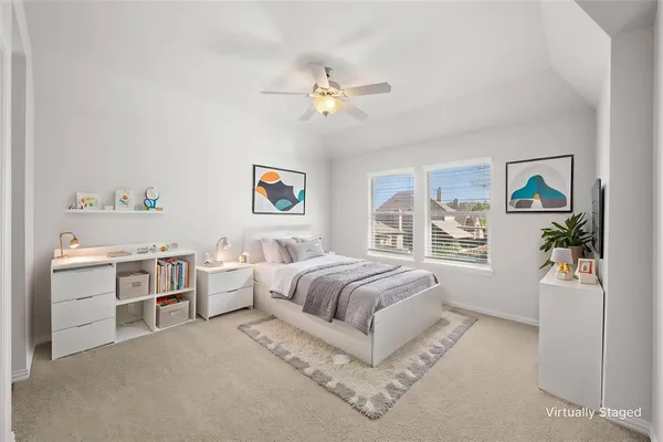 a spacious bedroom with a bed and a window