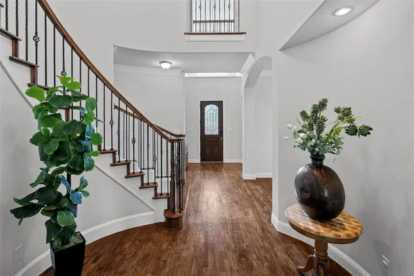 a view of entryway with wooden floor