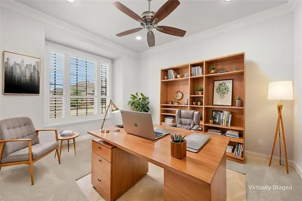 a living room with furniture a flat screen tv and a large window