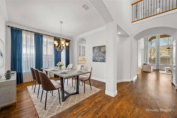 a view of a livingroom with furniture window and wooden floor