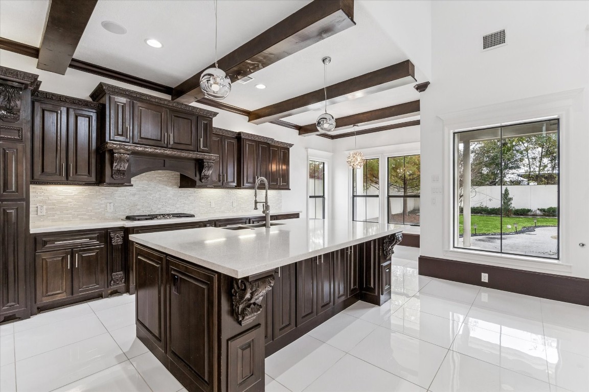 3942 Charleston Street Houston, TX 77021 - Photo 11 of 34 a kitchen with kitchen island a sink stove and cabinets